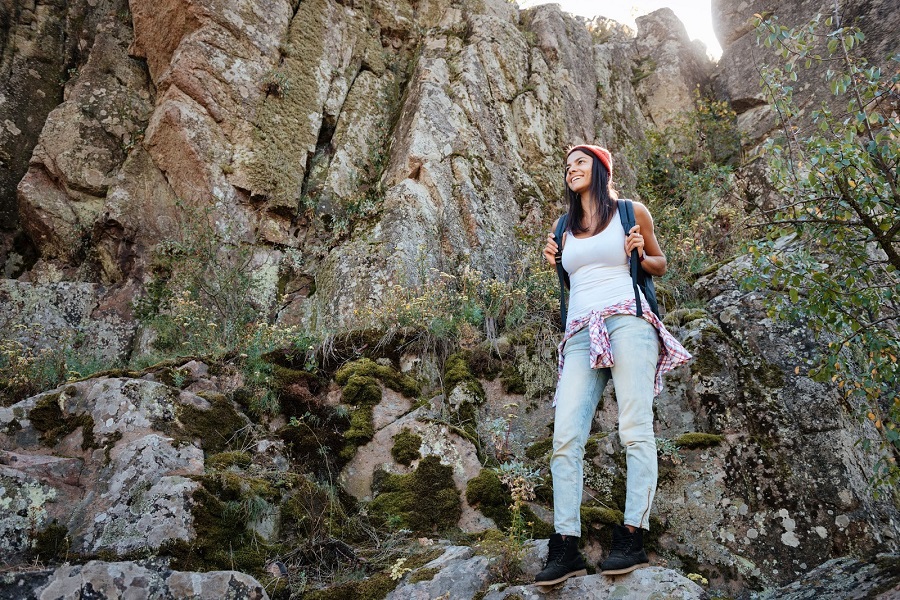 woman hiking on rocks